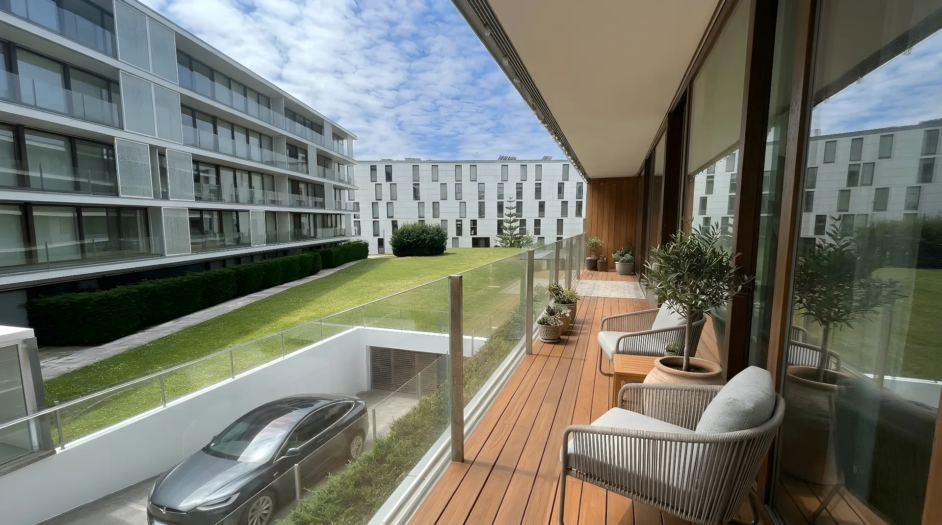 Exterior balcony of Guerra Junqueiro Residence — view over the private gardens and gated development in Boavista, Porto